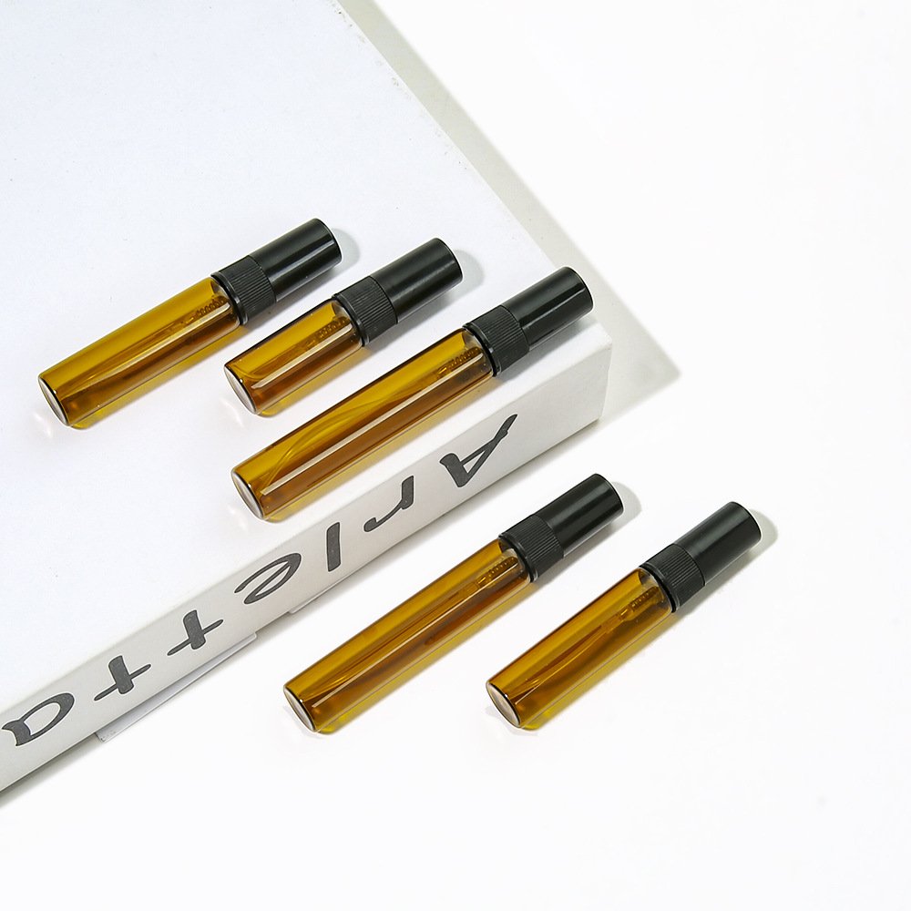 Amber Glass Spray Bottles Seven Sizes on White Steps
