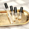 Slim Glass Atomizers on Golden Tray Marble Scene