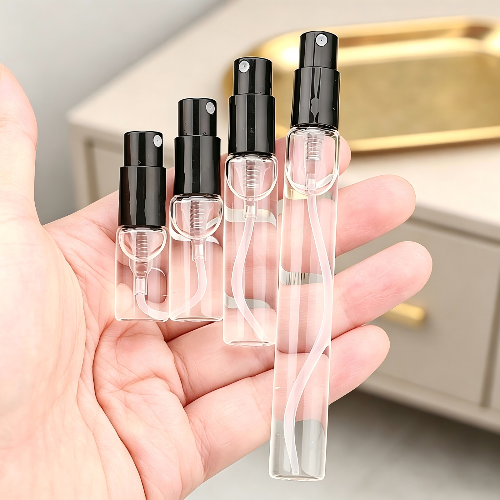 Mini Glass Spray Bottles in Hand Size Comparison