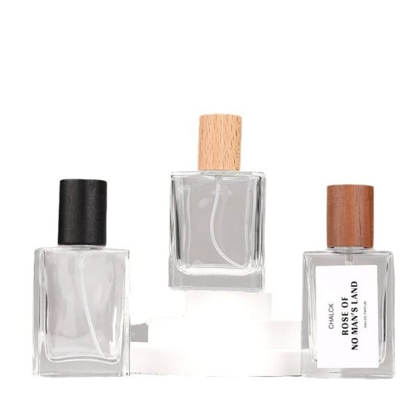 Three Square Glass Spray Bottles with Wooden Caps