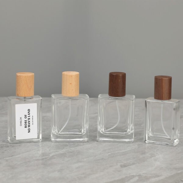 Four Glass Perfume Bottles Beech and Dark Wood Caps