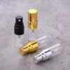 Three Mini Glass Spray Bottles Black Gold Silver on Marble