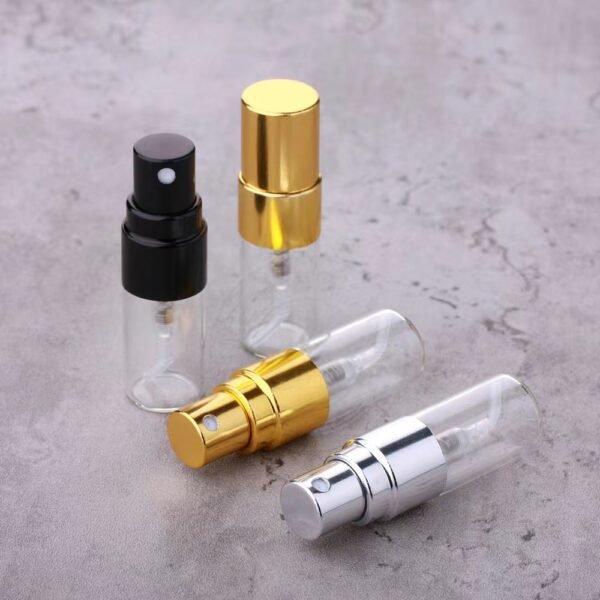 Three Mini Glass Spray Bottles Black Gold Silver on Marble