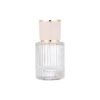 Ribbed Clear Glass Perfume Bottle White Gold Cap White Background