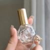 Rose Glass Perfume Bottle Gold Sprayer in Hand