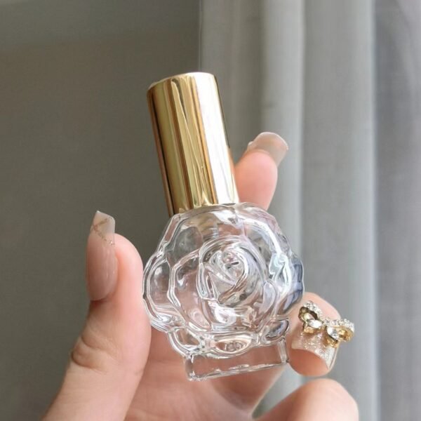 Rose Glass Perfume Bottle Gold Sprayer in Hand