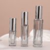 Smoke Grey Square Spray Bottles Three Sizes Pink Background