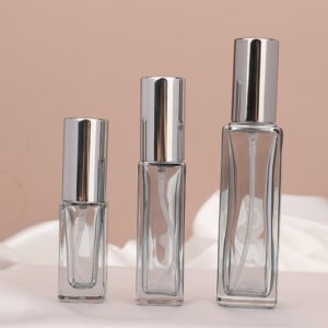 Smoke Grey Square Spray Bottles Three Sizes Pink Background