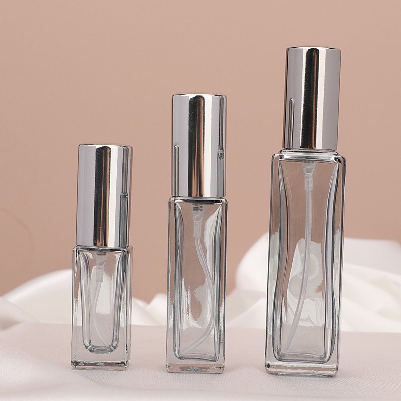 Smoke Grey Square Spray Bottles Three Sizes Pink Background