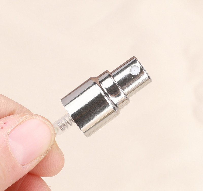 Silver-Tone Metal Sprayer Close-up in Hand