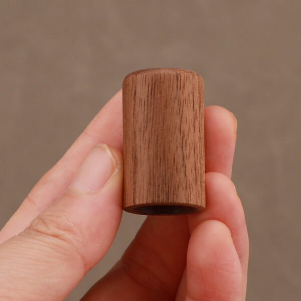 Walnut Wooden Cap Close-up in Hand