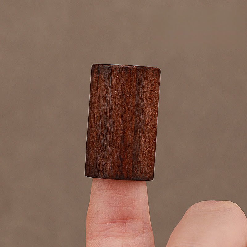 Dark Beech Wooden Cap Close-up on Finger
