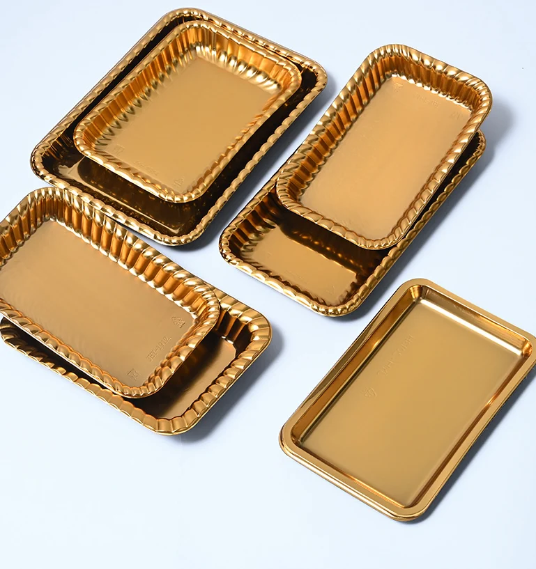 Gold PET disposable trays stacked without deformation